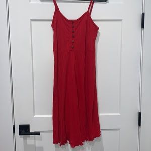Red sleeveless maternity dress.